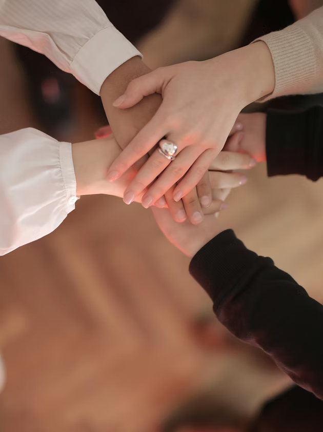 Hands joined together in support